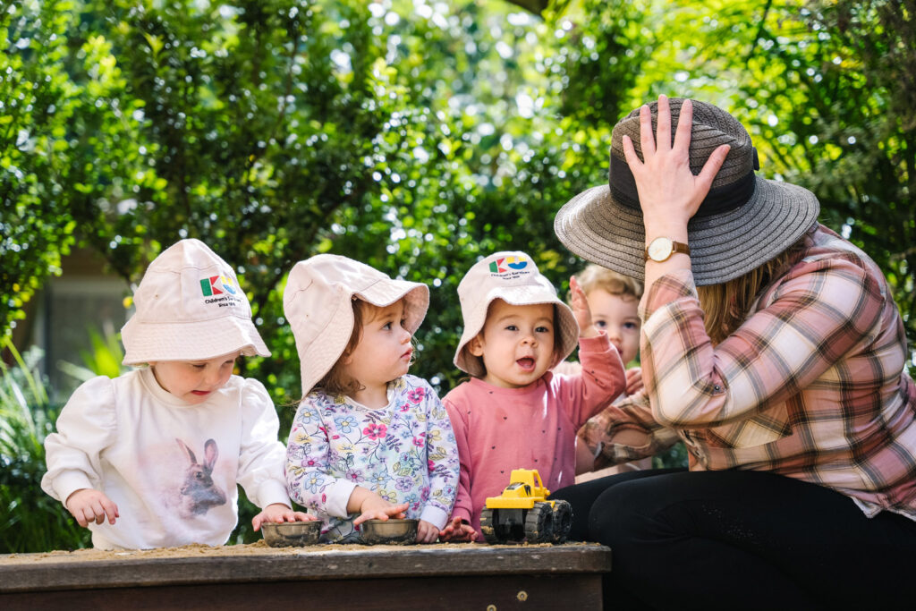 KU Ultimo childcare educator interacting with children outdoors