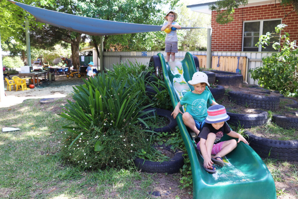 Children playing on the slide at KU Kookaburra childcare