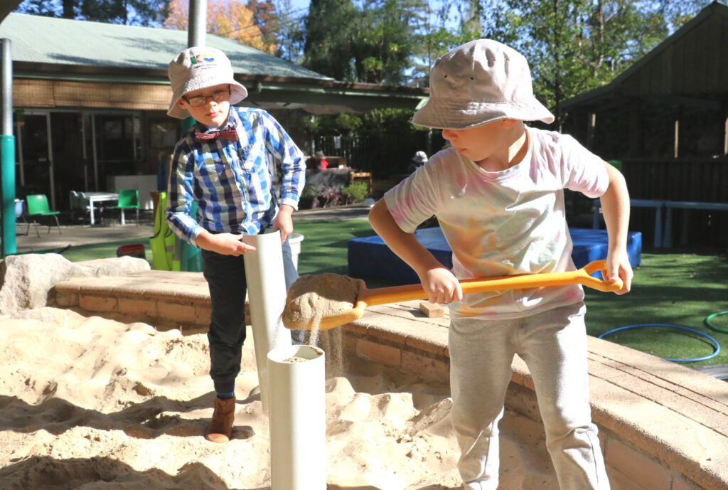 Children digging sand at KU Fox Valley childcare