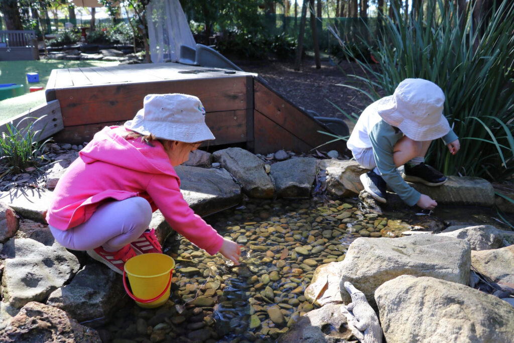 Children playing in water at KU West Pymble childcare