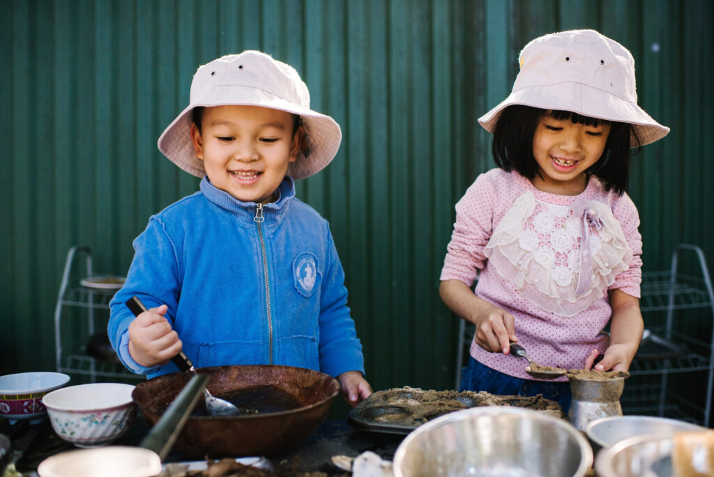 Children pretending to cook at KU Yagoona childcare