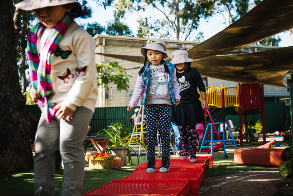 Children playing outdoors at KU Yagoona childcare