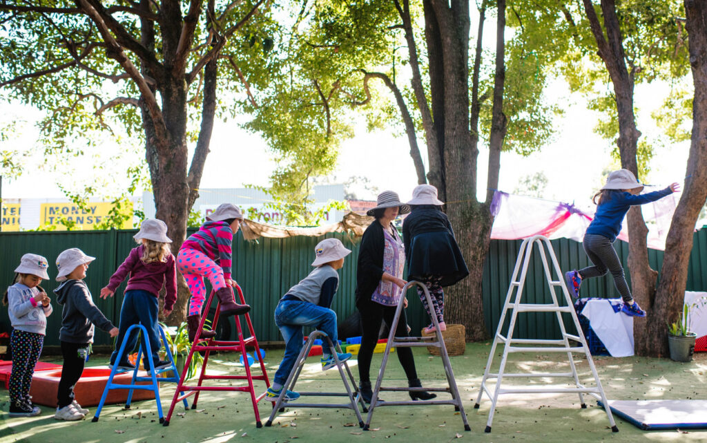 KU Yagoona childcare educator supervising children on the equipment